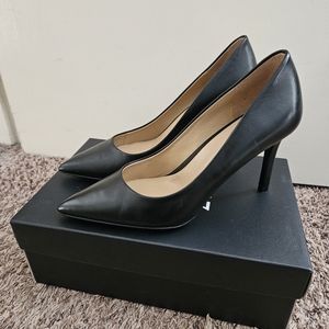 Black leather pumps